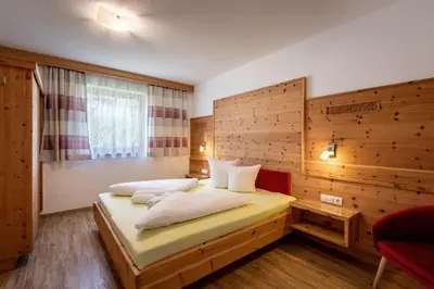 Ein Bett oder Betten in einem Zimmer der Unterkunft Apart-Magdalena Zillertal Mayrhofen