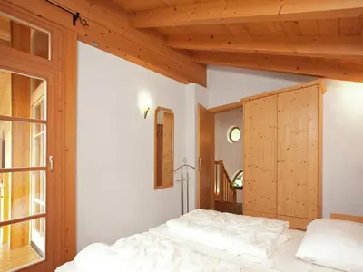 Ein Bett oder Betten in einem Zimmer der Unterkunft Chalet in Königsleiten near Ski Bus, Pool