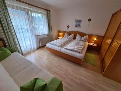 Ein Bett oder Betten in einem Zimmer der Unterkunft Landhaus KitzAlp (Alpenheim)