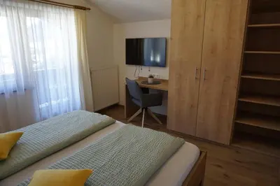 Ein Bett oder Betten in einem Zimmer der Unterkunft Landhaus KitzAlp (Alpenheim)