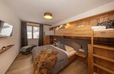 Ein Bett oder Betten in einem Zimmer der Unterkunft Bachgut, das Resort am Berg - Chalet 6