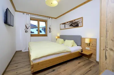 Ein Bett oder Betten in einem Zimmer der Unterkunft Bachgut, das Resort am Berg - Stammhaus Winter