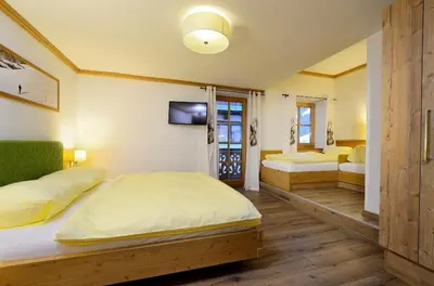 Ein Bett oder Betten in einem Zimmer der Unterkunft Bachgut, das Resort am Berg - Stammhaus Winter