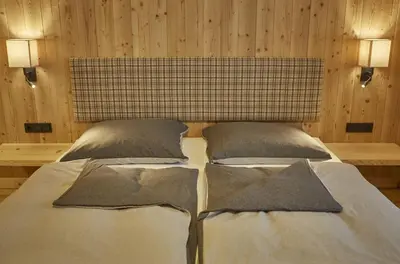Ein Bett oder Betten in einem Zimmer der Unterkunft Chalet Almglück by we rent, JOKERCARD INCLUDED