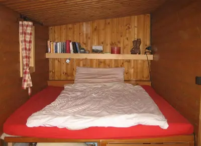 Ein Bett oder Betten in einem Zimmer der Unterkunft Mahderhütte
