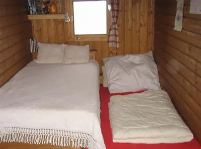 Ein Bett oder Betten in einem Zimmer der Unterkunft Mahderhütte
