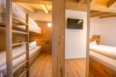 Ein Bett oder Betten in einem Zimmer der Unterkunft Wellnesschalet Tauern Juwel