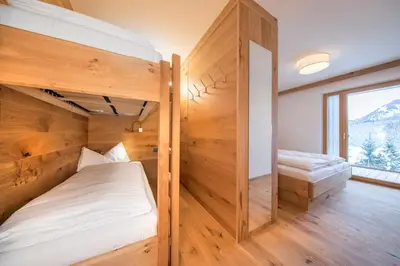 Ein Bett oder Betten in einem Zimmer der Unterkunft Wellnesschalet Tauern Juwel