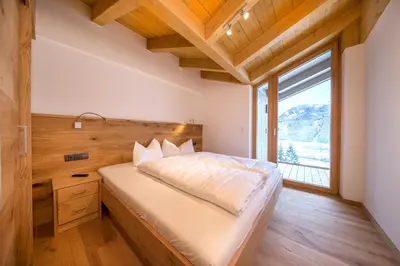 Ein Bett oder Betten in einem Zimmer der Unterkunft Wellnesschalet Tauern Juwel