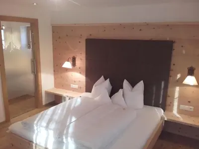 Ein Bett oder Betten in einem Zimmer der Unterkunft Tirol Appartement Haus Zillertal