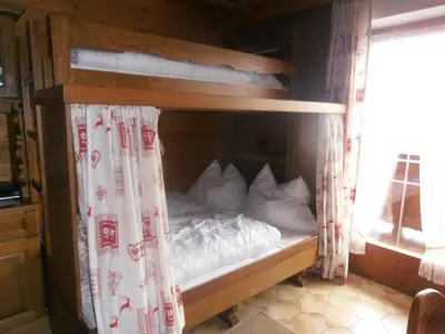 Ein Bett oder Betten in einem Zimmer der Unterkunft Gästehaus Hölzlbauer