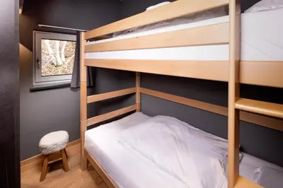 Ein Bett oder Betten in einem Zimmer der Unterkunft Schöneben Appartementen Big Family