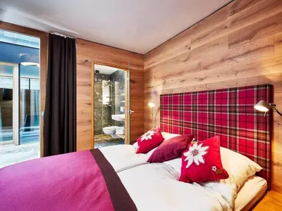 Ein Bett oder Betten in einem Zimmer der Unterkunft Smaragdresort Gipfelstürmer