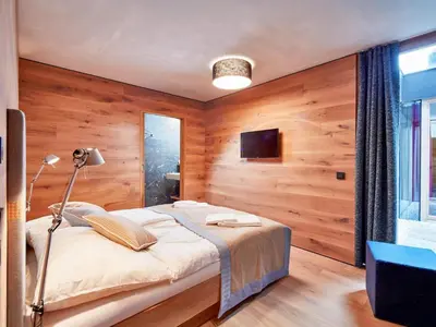 Ein Bett oder Betten in einem Zimmer der Unterkunft Smaragdresort Gipfelstürmer
