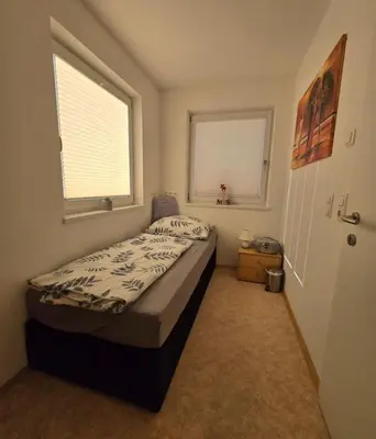Ein Bett oder Betten in einem Zimmer der Unterkunft Karos-Apartment