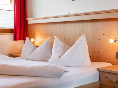 Ein Bett oder Betten in einem Zimmer der Unterkunft Landhaus Marchfeld Top 4 Top 5
