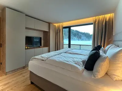 Ein Bett oder Betten in einem Zimmer der Unterkunft Alexander Mountain Suites