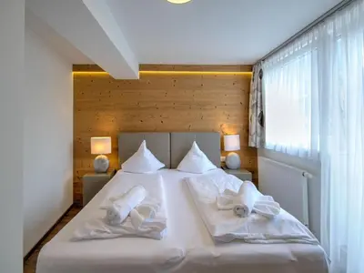 Ein Bett oder Betten in einem Zimmer der Unterkunft Brunner Apartment on the ski slope