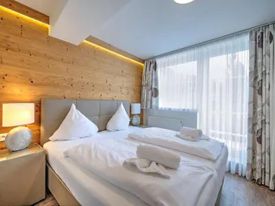 Ein Bett oder Betten in einem Zimmer der Unterkunft Brunner Apartment on the ski slope