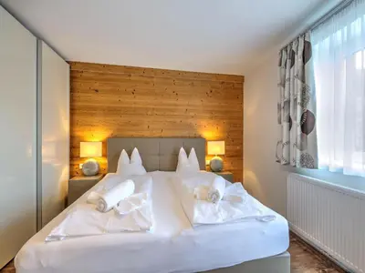Ein Bett oder Betten in einem Zimmer der Unterkunft Wildschönau Alpine Ski Brunner Apartment