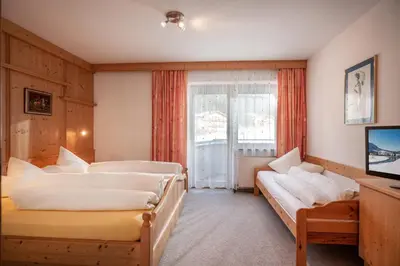 Ein Bett oder Betten in einem Zimmer der Unterkunft Pension Essbaum