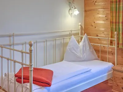 Ein Bett oder Betten in einem Zimmer der Unterkunft Holiday Village Wildschönau Traditional Chalet