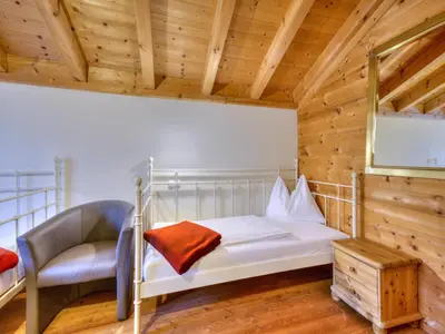 Ein Bett oder Betten in einem Zimmer der Unterkunft Holiday Village Wildschönau Family Chalet