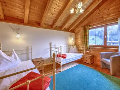 Ein Bett oder Betten in einem Zimmer der Unterkunft Feriendorf Wildschönau- Cozy Alpine Chalet