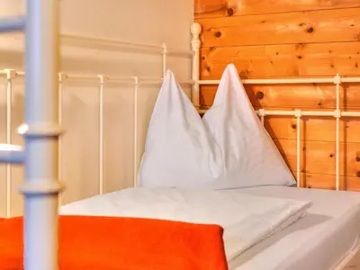 Ein Bett oder Betten in einem Zimmer der Unterkunft Feriendorf Wildschönau near sauna