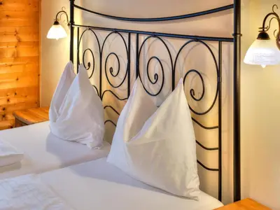 Ein Bett oder Betten in einem Zimmer der Unterkunft Feriendorf Wildschönau near sauna