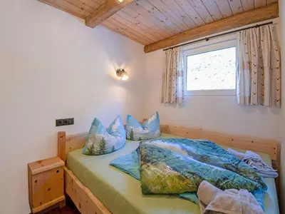 Ein Bett oder Betten in einem Zimmer der Unterkunft Cabin with sauna near Spieljoch Ski