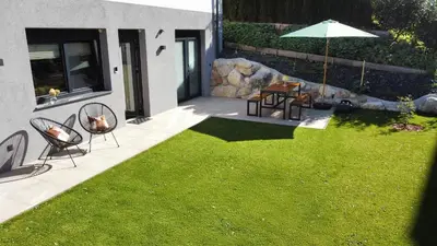 Ein Garten an der Unterkunft Bichler's Alpennest