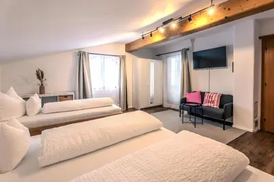 Ein Bett oder Betten in einem Zimmer der Unterkunft Zimmermanns - Alpine Living