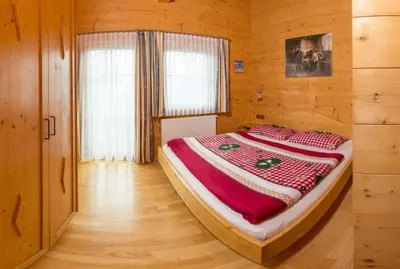 Ein Bett oder Betten in einem Zimmer der Unterkunft Chalet Brechhorn Landhaus
