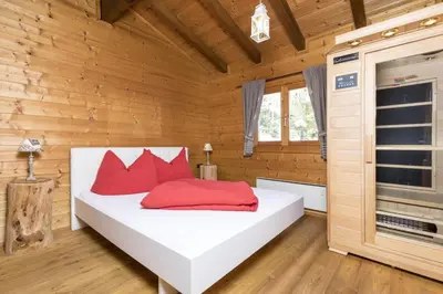 Ein Bett oder Betten in einem Zimmer der Unterkunft Alpen-Chalets Achensee