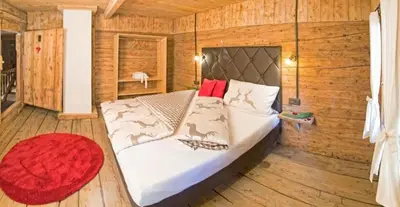 Ein Bett oder Betten in einem Zimmer der Unterkunft Bergchalet Heidialm