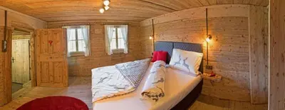 Ein Bett oder Betten in einem Zimmer der Unterkunft Bergchalet Heidialm