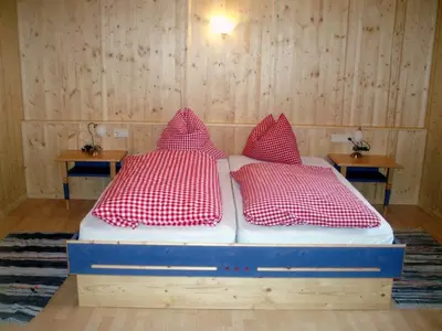 Ein Bett oder Betten in einem Zimmer der Unterkunft Kogelalm