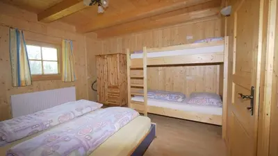 Ein Bett oder Betten in einem Zimmer der Unterkunft Kogelalm