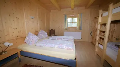 Ein Bett oder Betten in einem Zimmer der Unterkunft Kogelalm