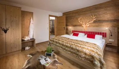 Ein Bett oder Betten in einem Zimmer der Unterkunft Bachgut Jagdhaus Chalet