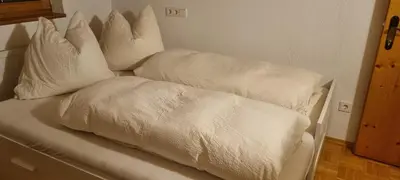 Ein Bett oder Betten in einem Zimmer der Unterkunft Wöscherhof