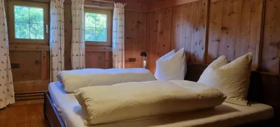 Ein Bett oder Betten in einem Zimmer der Unterkunft Wöscherhof