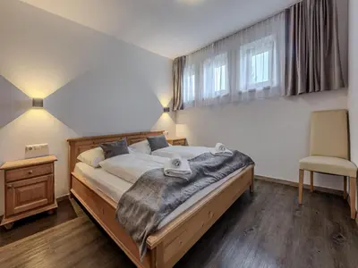 Ein Bett oder Betten in einem Zimmer der Unterkunft Modern apartment in Jochberg with terrace