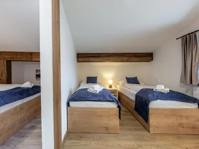 Ein Bett oder Betten in einem Zimmer der Unterkunft Holiday apartment in Jochberg near the ski lift
