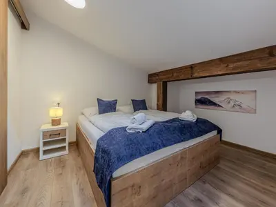 Ein Bett oder Betten in einem Zimmer der Unterkunft Holiday apartment in Jochberg near the ski lift