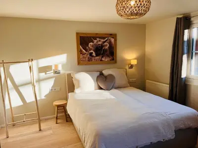 Ein Bett oder Betten in einem Zimmer der Unterkunft Lodge Rose's Heart