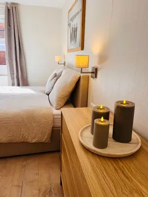 Ein Bett oder Betten in einem Zimmer der Unterkunft Lodge Rose's Heart