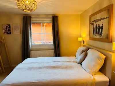 Ein Bett oder Betten in einem Zimmer der Unterkunft Lodge Rose's Heart