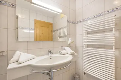Ein Badezimmer in der Unterkunft Alpenkönig